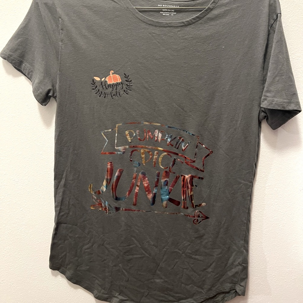Get ready for fall in the adorable Pumpkin spice junkie t-shirt.